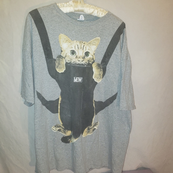 cat in a baby carrier shirt